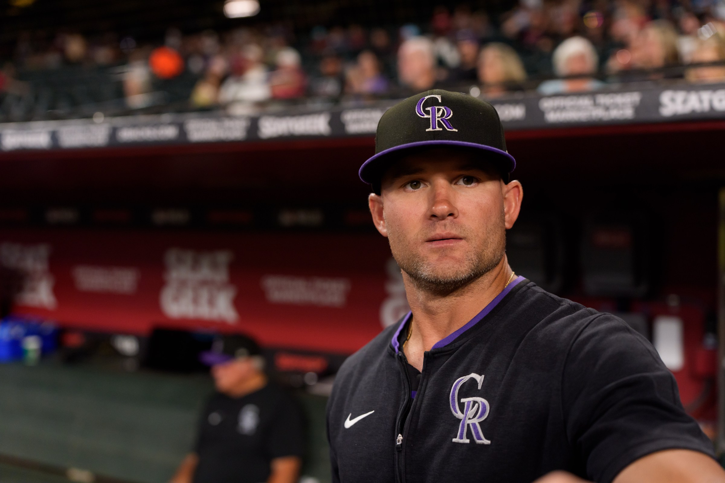 Aug 8, 2025; Phoenix, Arizona, USA; Colorado Rockies interim manager Warren Schaeffer (32) watches on from the dugout during the early innings of a game against the Arizona Diamondbacks at Chase Field. Mandatory Credit: Allan Henry-Imagn Images