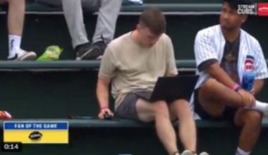 Cubs fan goes viral after working on laptop from during Brewers game - Watch