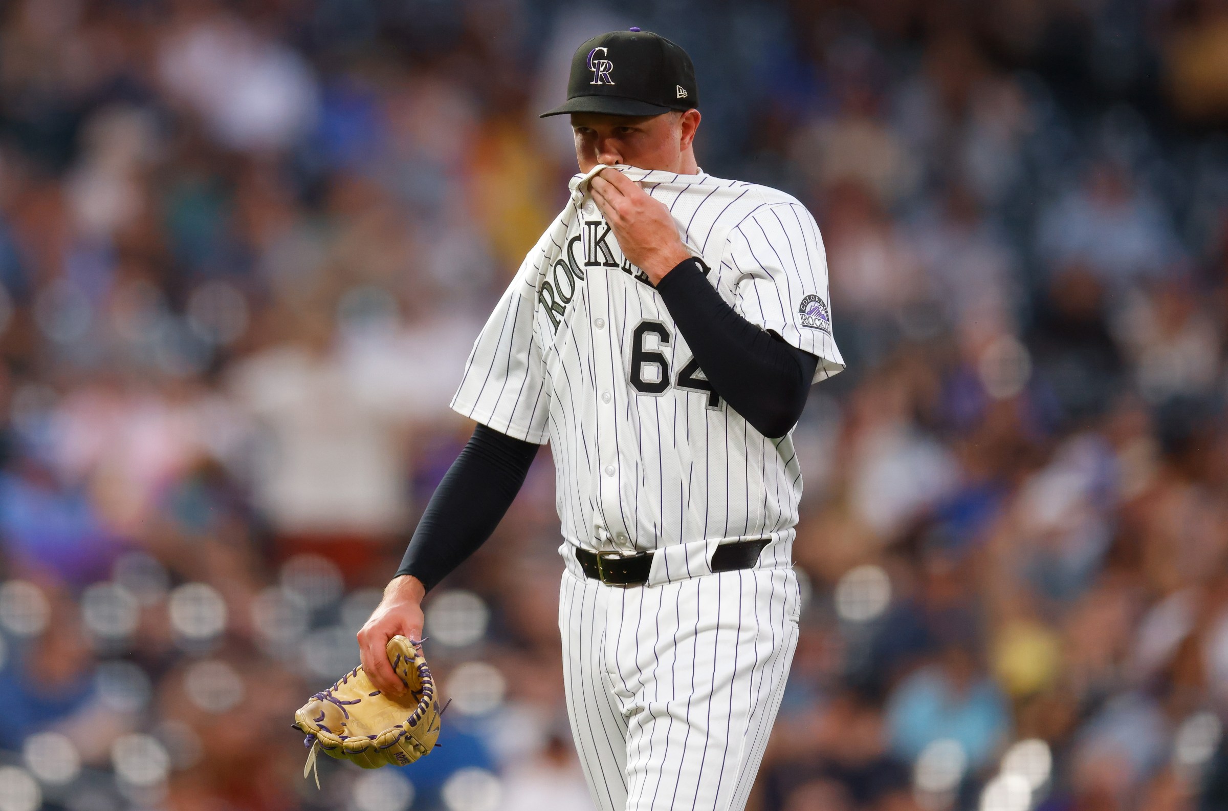 DENVER, CO - AUGUST 14: Bradley Blalock #64 of the Colorado Rockies reacts as he walks off the field after being removed from the game in the fourth inning against the Arizona Diamondbacks at Coors Field on August 14, 2025 in Denver, Colorado. (Photo by Justin Edmonds/Getty Images)