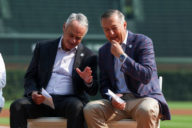 MLB Commissioner Rob Manfred, left, speaks to Cubs Chairman Tom Ricketts on Aug. 1, 2025, before a ceremony announcing Wrigley Field will host the 2027 All-Star Game. (Eileen T. Meslar/Chicago Tribune)