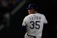 Texas Rangers starting pitcher Jack Leiter winds up to deliver to the Cleveland Guardians in...