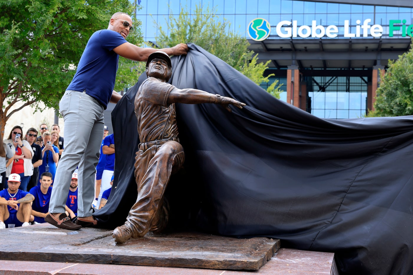 Texas Rangers Baseball Hall of Famer Adrian Beltre pulls the drape back to see his full-size...