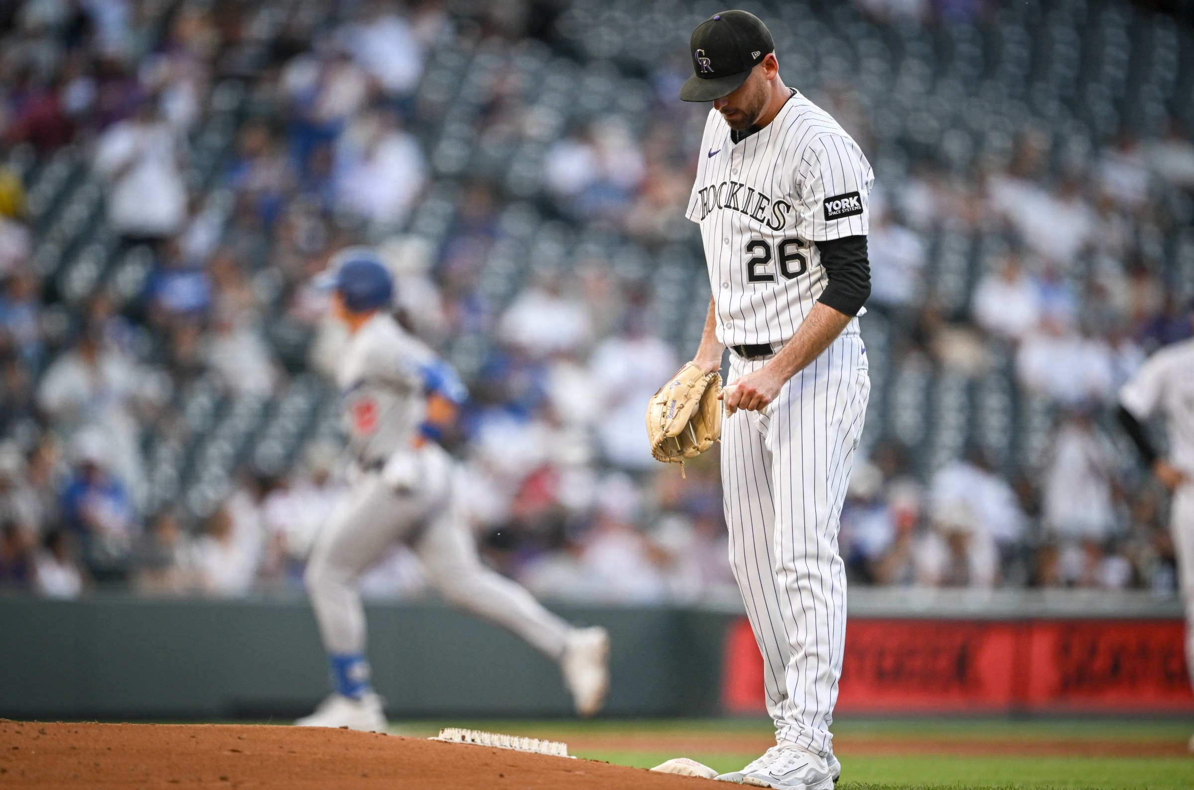 DENVER, CO - AUGUST 19: Austin Gomber (26) of the Colorado Rockies reacts to giving up a solo homerun to Alex Call (12) of the Los Angeles Dodgers during the second inning at Coors Field in Denver on Tuesday, August 19, 2025. (Photo by AAron Ontiveroz/The Denver Post)