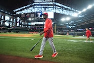 Los Angeles Angels manager Ron Washington walks on the field during batting practice before...