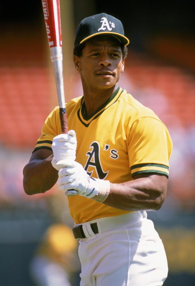 OAKLAND, CA - 1989: (FILE PHOTO) Rickey Henderson #22 of the Oakland Athletics warms-up for a 1989 season game at the Oakland-Alameda County Coliseum in Oakland, California. Major League Baseball announced January 12, 2009 that Henderson was elected to the National Baseball Hall of Fame during his first chance on the ballot. (Photo by Otto Greule Jr/Getty Images)