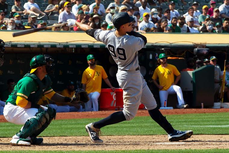 The Yankees’ Aaron Judge belts a ninth-inning home run against the Athletics at RingCentral Coliseum in Oakland, California, on Aug. 28, 2021.