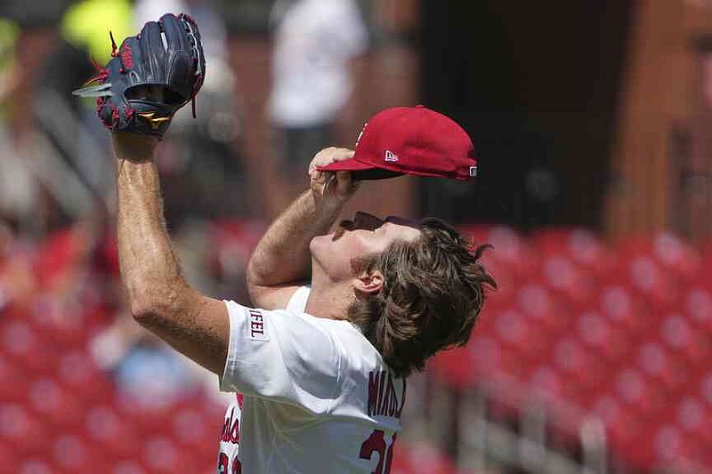 St. Louis Cardinals starting pitcher Miles Mikolas adjusts his cap after giving up a solo home run to Pittsburgh Pirates' Tommy Pham during the first inning of a baseball game Thursday, Aug. 28, 2025, in St. Louis. (AP Photo/Jeff Roberson)
