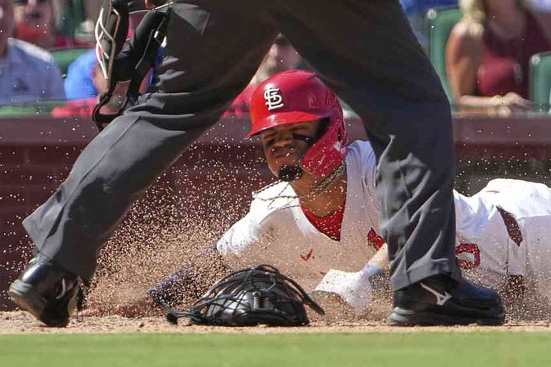St. Louis Cardinals' Masyn Winn scores during the seventh inning of a baseball game against the Pittsburgh Pirates Thursday, Aug. 28, 2025, in St. Louis. (AP Photo/Jeff Roberson)