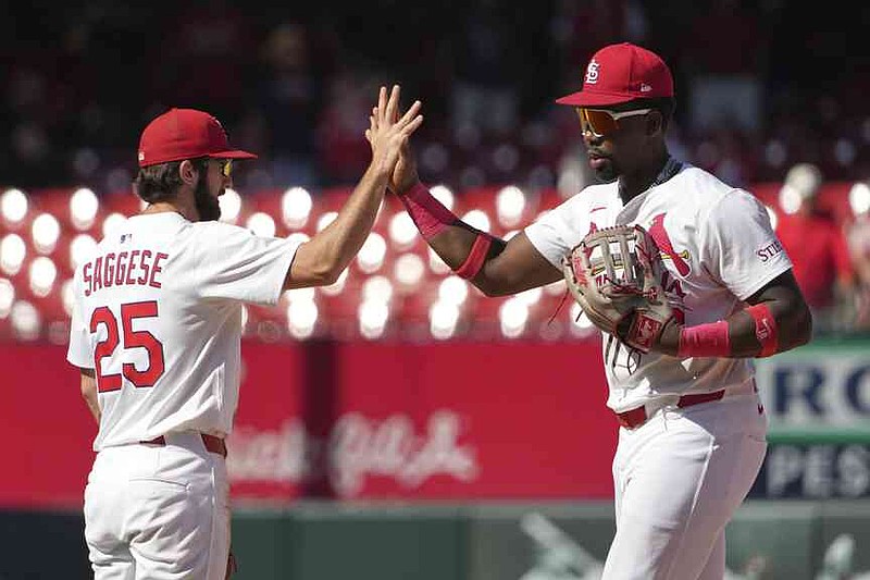 St. Louis Cardinals' Thomas Saggese (25) and Jordan Walker celebrate a victory over the Pittsburgh Pirates following a baseball game Thursday, Aug. 28, 2025, in St. Louis. (AP Photo/Jeff Roberson)