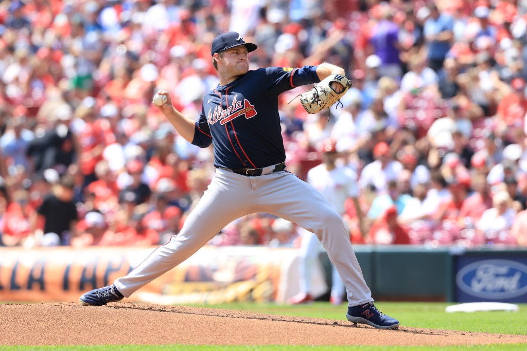 Atlanta Braves pitcher pitching a baseball.