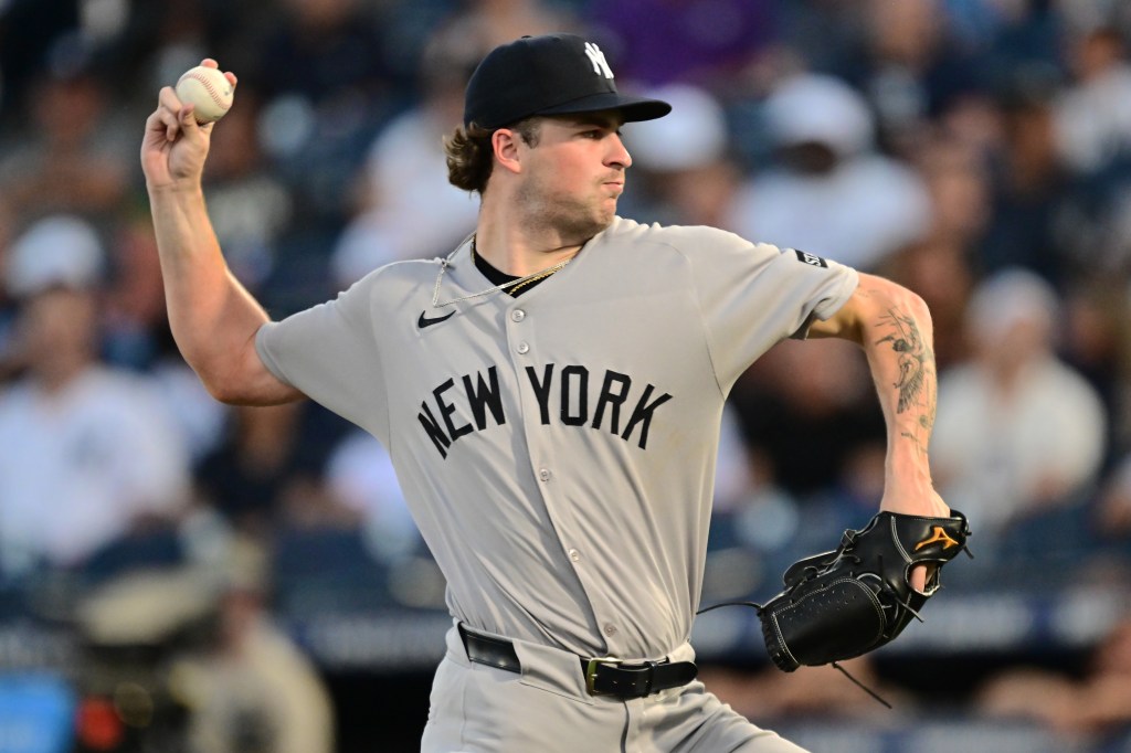 New York Yankees pitcher throwing a baseball.