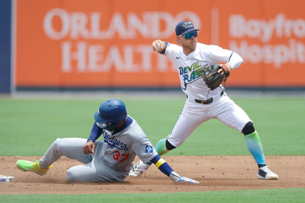 Taylor Walls #6 of the Tampa Bay Rays turns a double play against the Los Angeles Dodgers at George M. Steinbrenner Field on August 02, 2025 in Tampa, Florida.