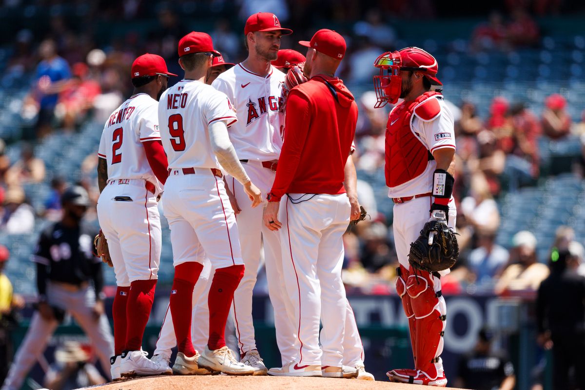 Los Angeles Angels players visit Jack Kochanowicz #41 of the Los Angeles Angels on the mound during the game against the Chicago White Sox at Angel Stadium of Anaheim on August 3, 2025 in Anaheim, California.