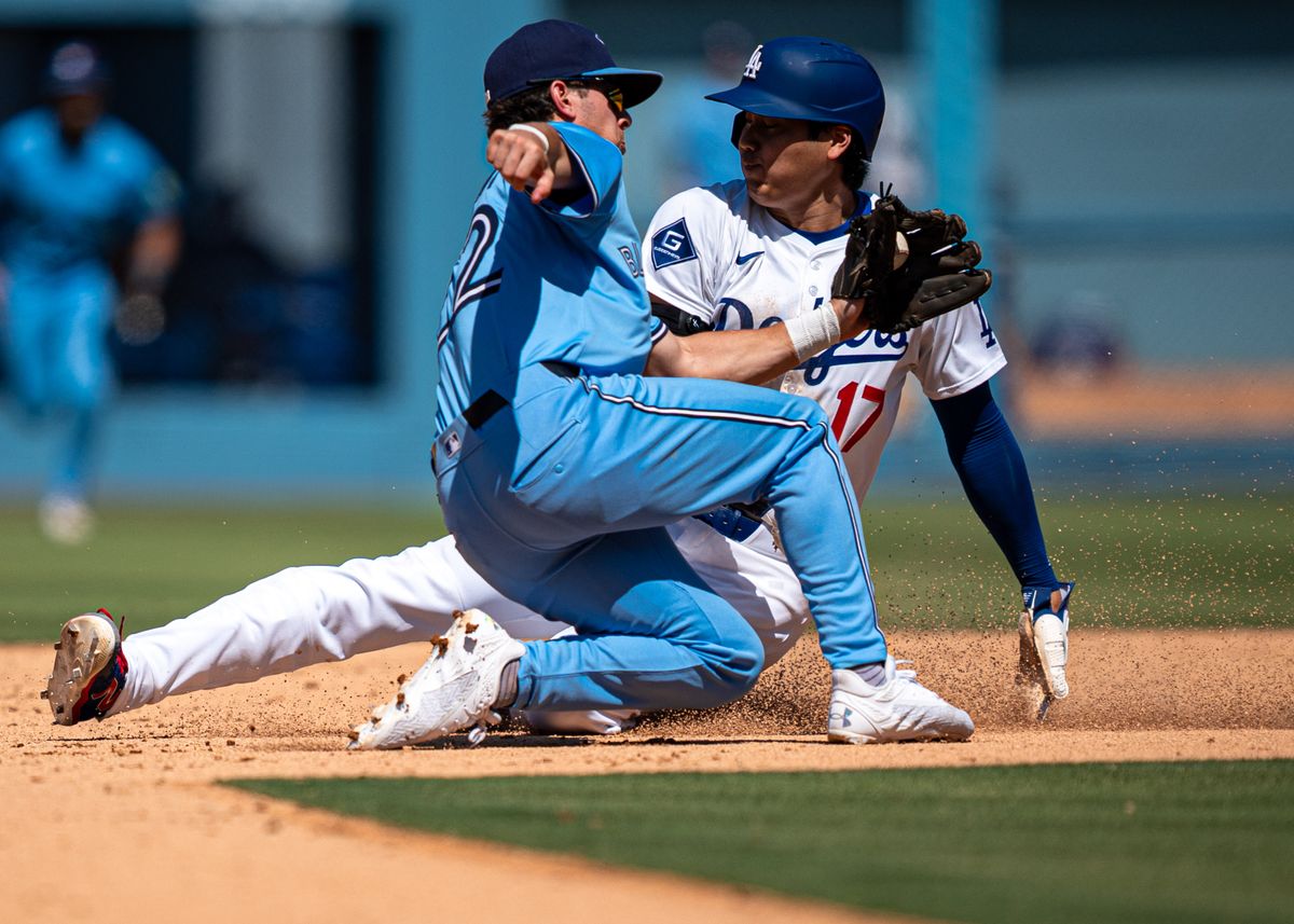 Los Angeles Dodgers pitcher, Shohei Ohtani 17, attempts to steal second base during an MLB baseball game against the Toronto Blue Jays on August 10th, 2025 in Los Angeles, CA.