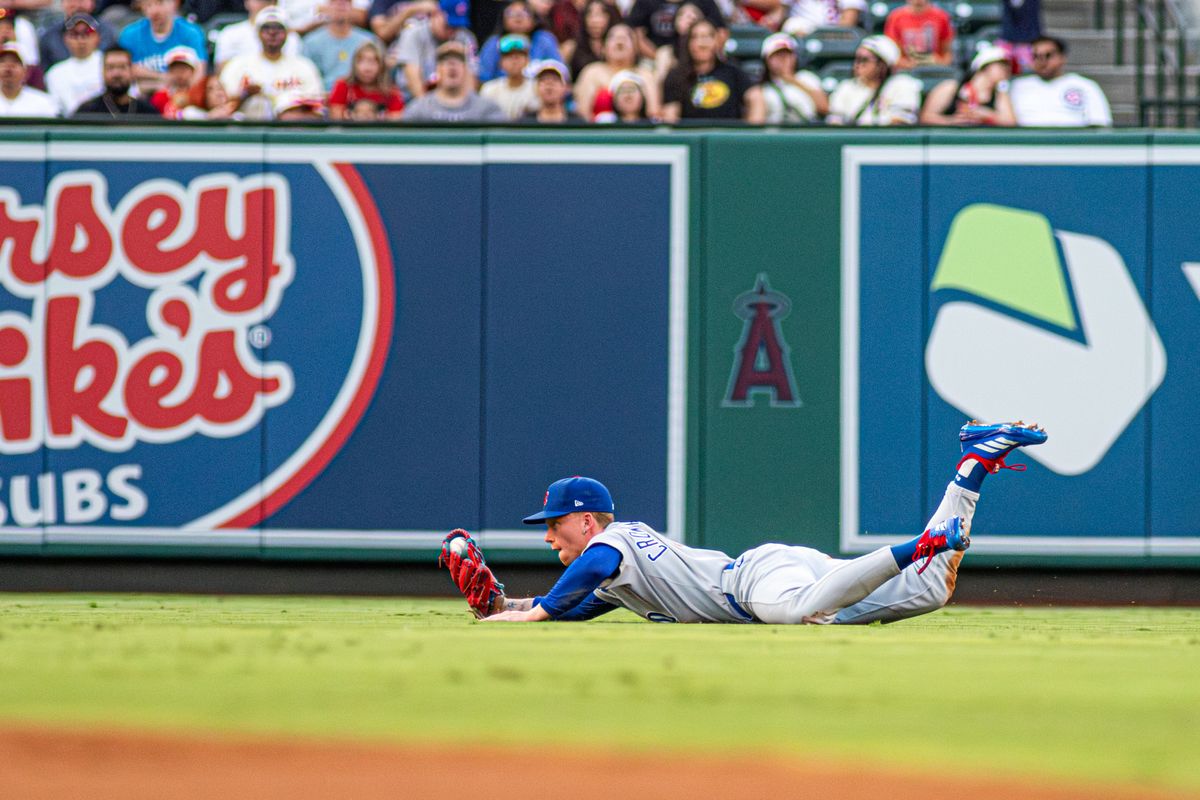 Chicago Cubs Outfielder Pete Crow-Armstrong (4) makes a diving play in an MLB game against the Los Angeles Angels Saturday, August 23, 2025 at Angels Stadium in Anaheim, California.
