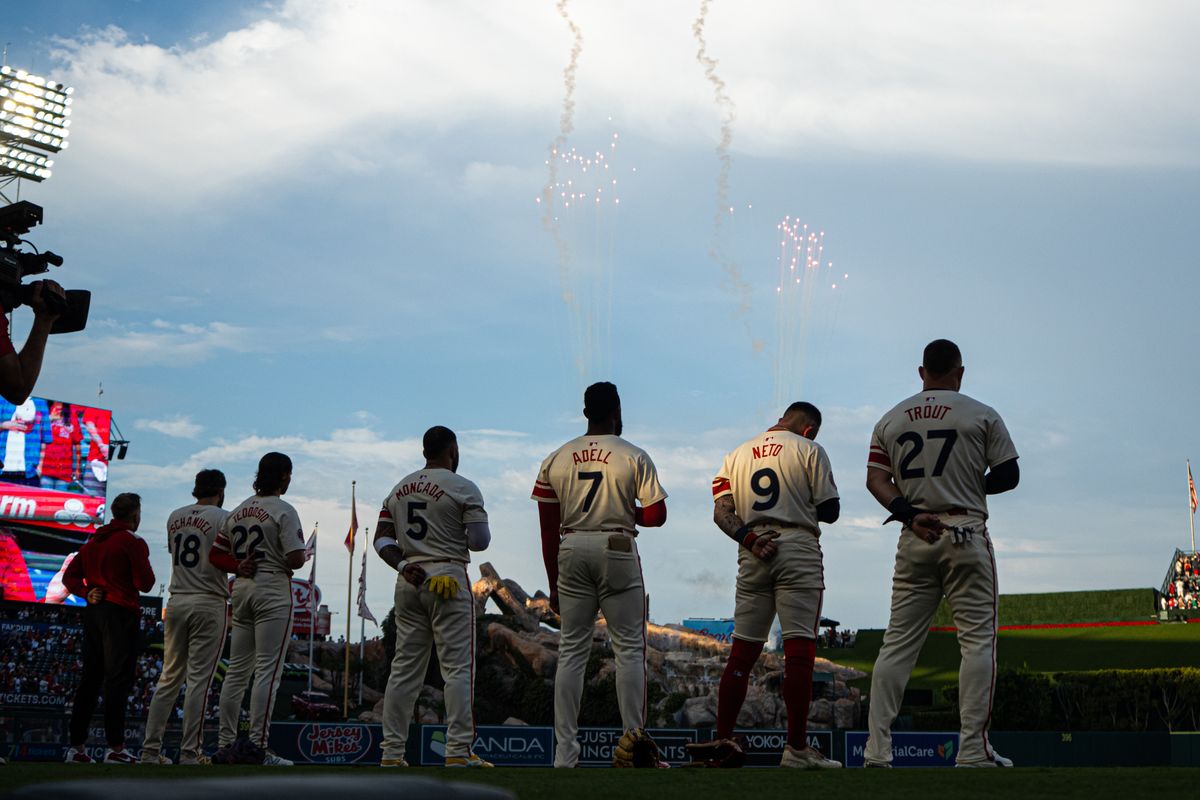 Los Angeles Angels players during the national anthem before an MLB game against the Chicago Cubs on Saturday, August 23, 2025 at Angels Stadium in Anaheim, California.