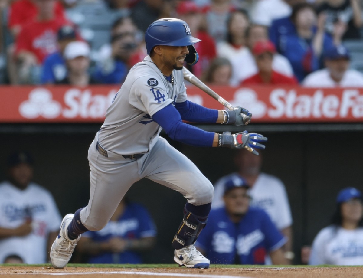 ANAHEIM:  Mookie Betts #50 of the Los Angeles Dodgers reacts to his RBI single during the first inning against the Los Angeles Angels, to score Shohei Ohtani #17 for a 1-0 lead, at Angel Stadium of Anaheim. – AFP