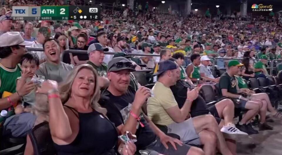 Caught In The Act – Oakland A’s Fan Leaves Commentators Speechless As He Shamelessly Grabs A Handful Of His Girlfriend’s Chest On Live TV [VIDEO]