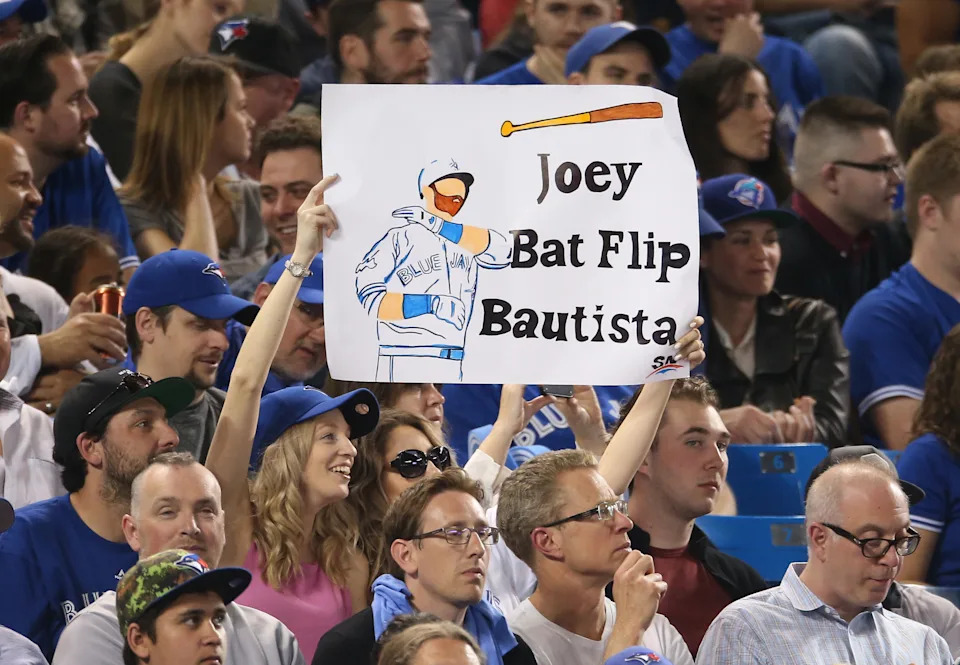 TORONTO, CANADA - MAY 5: Fans hold up a sign referencing the bat flip by Jose Bautista #19 of the Toronto Blue Jays in last season