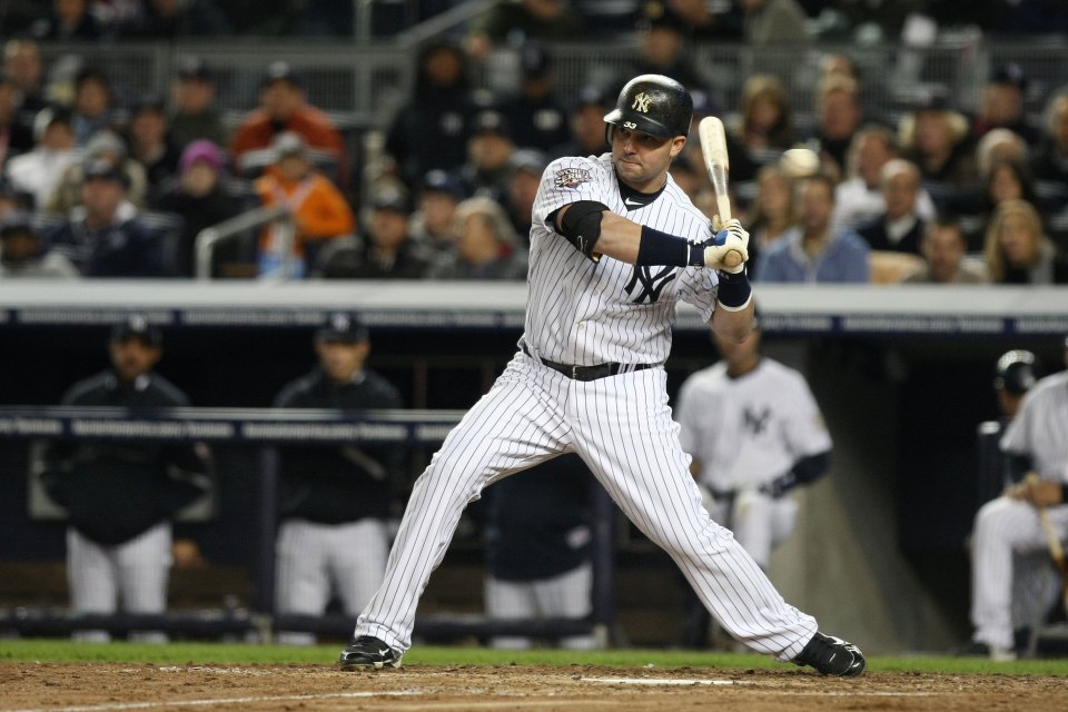 New York Yankees player Nick Swisher batting during a baseball game.