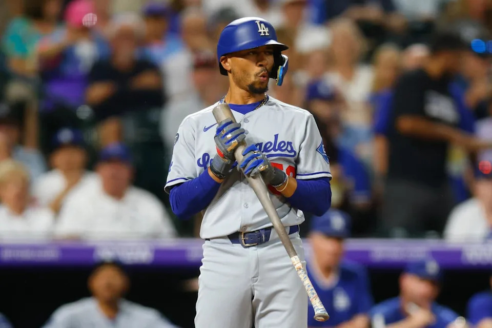 DENVER, CO - AUGUST 18: Mookie Betts #50 of the Los Angeles Dodgers reacts.