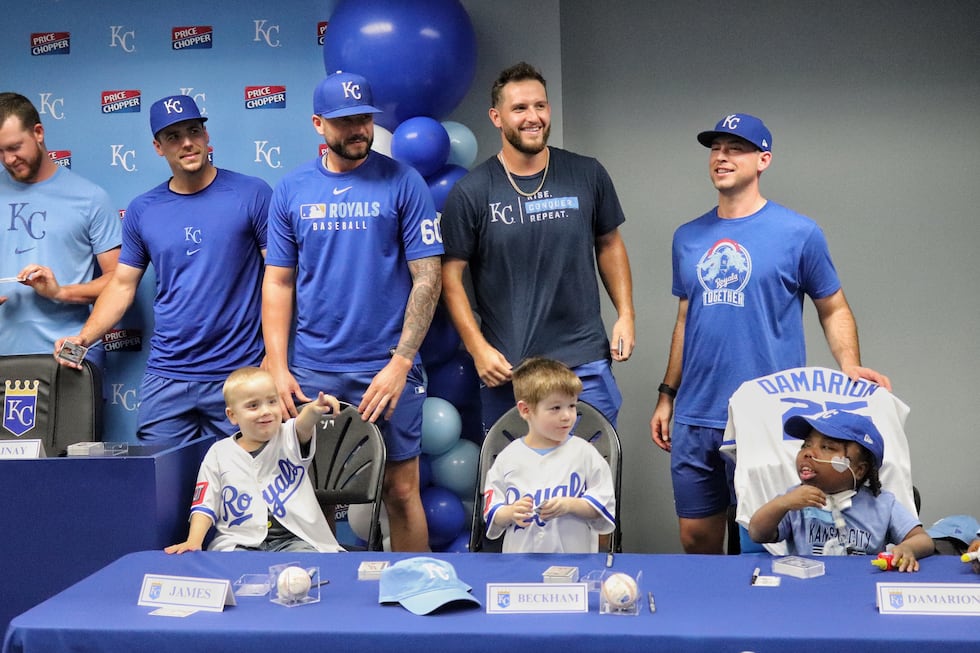 Autograph sessions aren’t unusual at Kauffman Stadium – but today, Royals players weren’t...