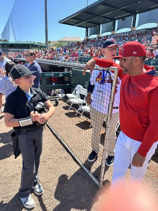 Bradley Vinson meets Cardinals manager Oli Marmol during spring training. (Photos courtesy: John Vinson)