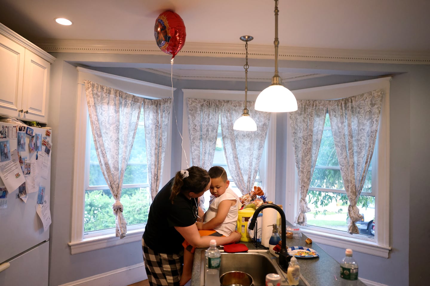 Christina Toledo comforted her son Jhon after he refused to blow out the candles on his birthday cake with his twin brother in June. “I don’t want birthday. I want Daddy,” Jhon said of his father, who was taken away by ICE weeks prior and was now in detention awaiting a bond hearing.