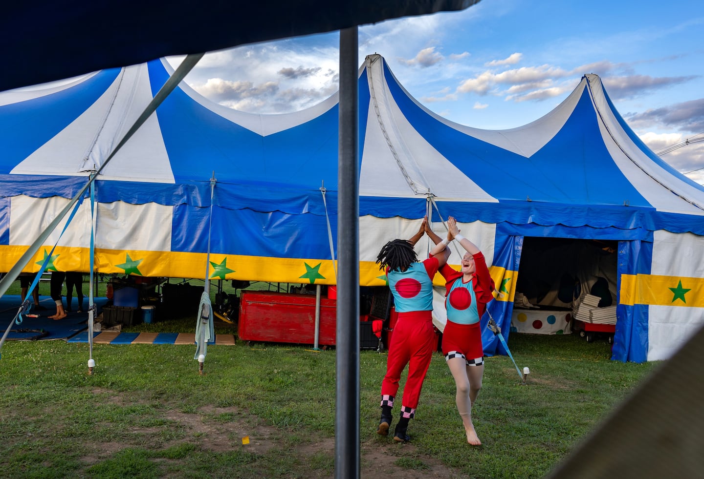 Nelson Wilson, 18, of Providence, and Sekora Berge, 15, of Plymouth, Wis., did a warmup before going in for the 7 p.m. show at the Circus Smirkus 2025 Big Top Tour in Wrentham on July 22.


