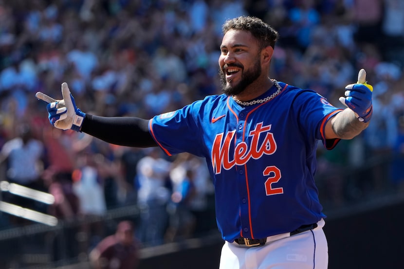 New York Mets' Omar Narváez celebrates with teammates after hitting a walkoff single during...