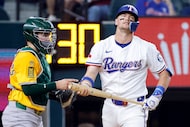 Texas Rangers batter Josh Jung (6) reacts after striking out during the third inning against...