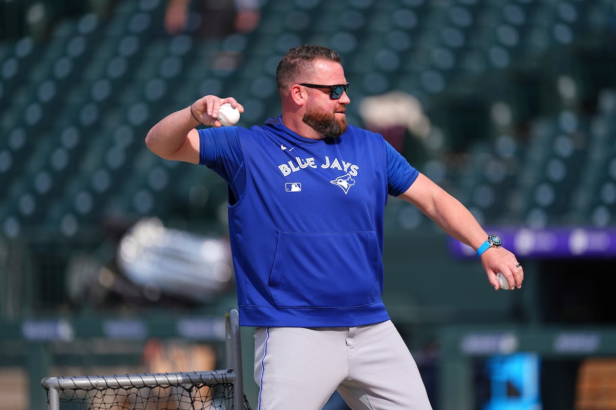 Before the game starts, John Schneider gets Jays’ batters ready
