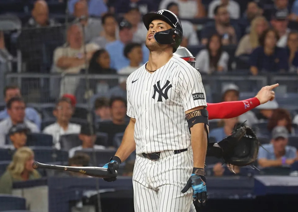 A frustrated Giancarlo Stanton walks back to the dugout after striking out in the sixth inning of the Yankees’ loss to the Twins. Robert Sabo / New York Post