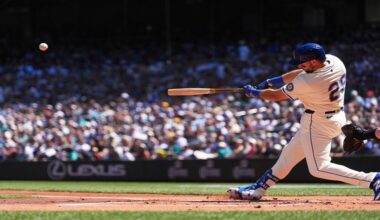 Seattle Mariners designated hitter Cal Raleigh hits a two-run home run against the Tampa Bay Rays during the first inning of a baseball game Sunday, Aug. 10, 2025, in Seattle. (AP Photo/Lindsey Wasson)