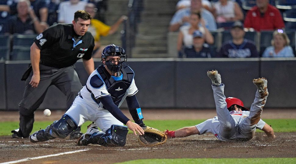 St. Louis Cardinals' Thomas Saggese, right, scores as the throw skips away from Tampa Bay Rays catcher Nick Fortes on a fielder's choice by Nathan Church during the second inning of a baseball game Thursday, Aug. 21, 2025, in Tampa, Fla. (AP Photo/Chris O'Meara)