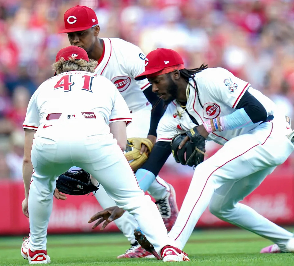 Starting pitcher Andrew Abbott, third baseman Ke'Bryan Hayes shortstop Elly De La Cruz converge on the ball in the first inning of the Reds' 4-2 loss to the St. Louis Cardinals Aug. 30. The Reds ended up with an inning-ending double play after the infield fly rule was called after the pop-up was hit.