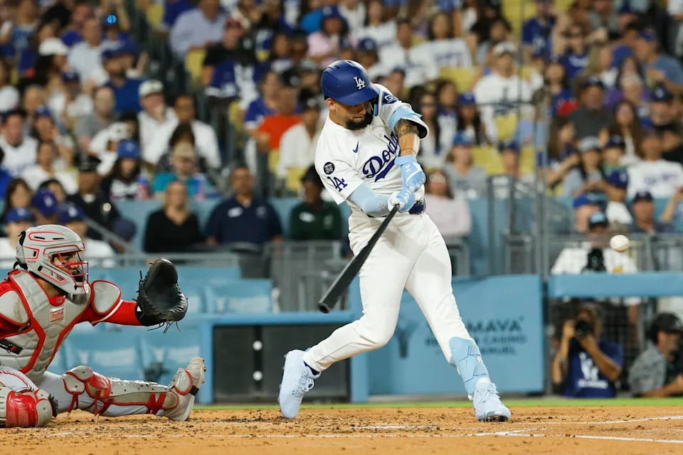 Andy Pages hits a home run in the third inning for the Dodgers against the Reds on Monday.