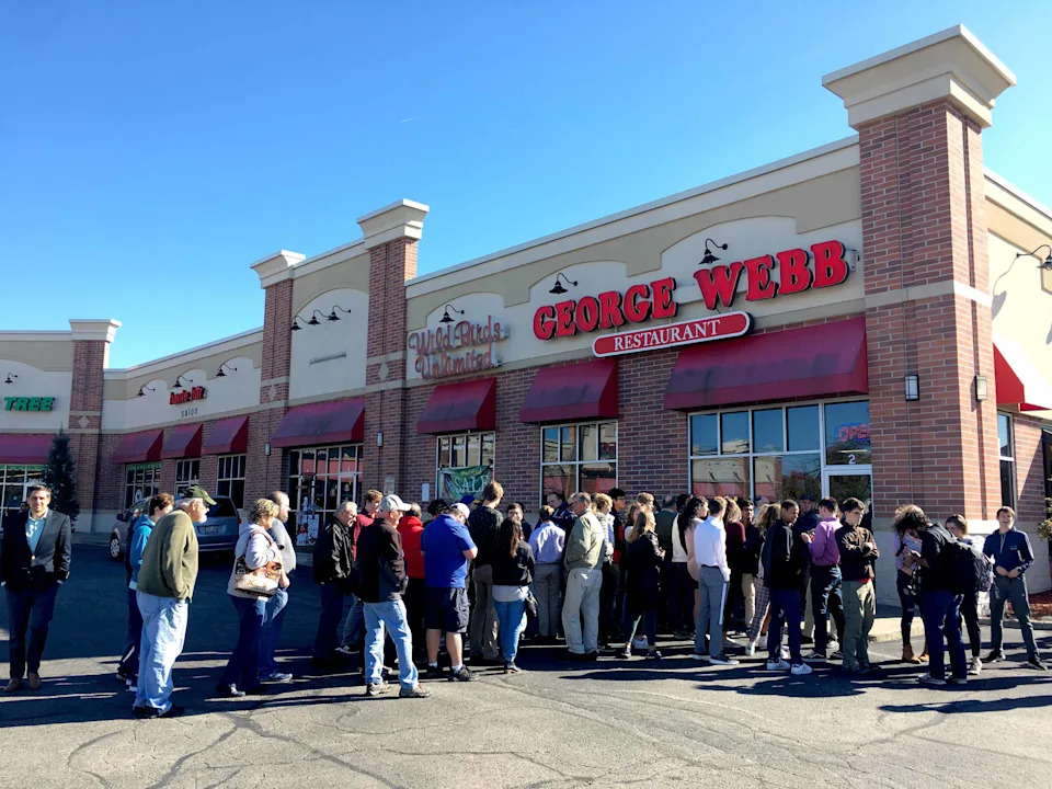 Customers wait in line for free hamburgers at George Webb on West Bluemound Road, in Brookfield in October of 2018, the last time the Brewers won 12 straight games.