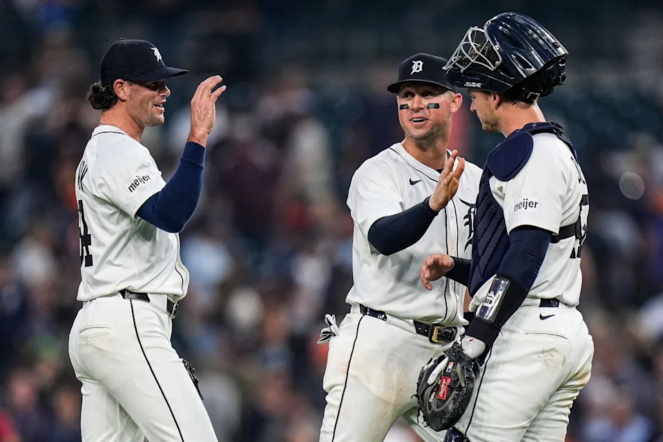 From left, Detroit Tigers pitcher Kyle Finnegan (64), first base Spencer Torkelson (20) high-fives catcher Dillon Dingler (13) to celebrate 6-3 win over Minnesota Twins at Comerica Park in Detroit in Monday, August 4, 2025.