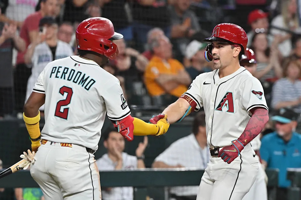Arizona Diamondbacks outfielder Corbin Carroll (7) celebrates with shortstop Geraldo Perdomo (2) after hitting a solo home run in the third inning against the Baltimore Orioles at Chase Field. Source: Matt Kartozian-Imagn Images