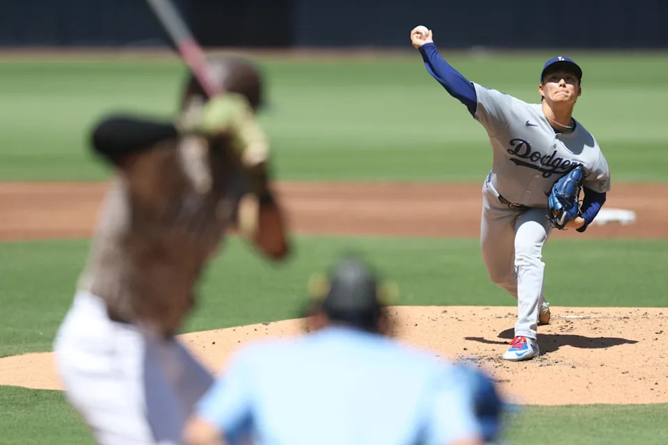 Dodgers starting pitcher Yoshinobu Yamamoto delivers against the Padres in the first inning Sunday.
