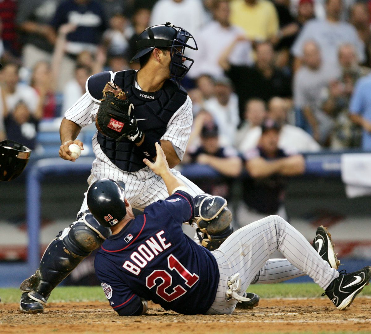 New York Yankees’ Jorge Posada tags out Minnesota Twins Bret