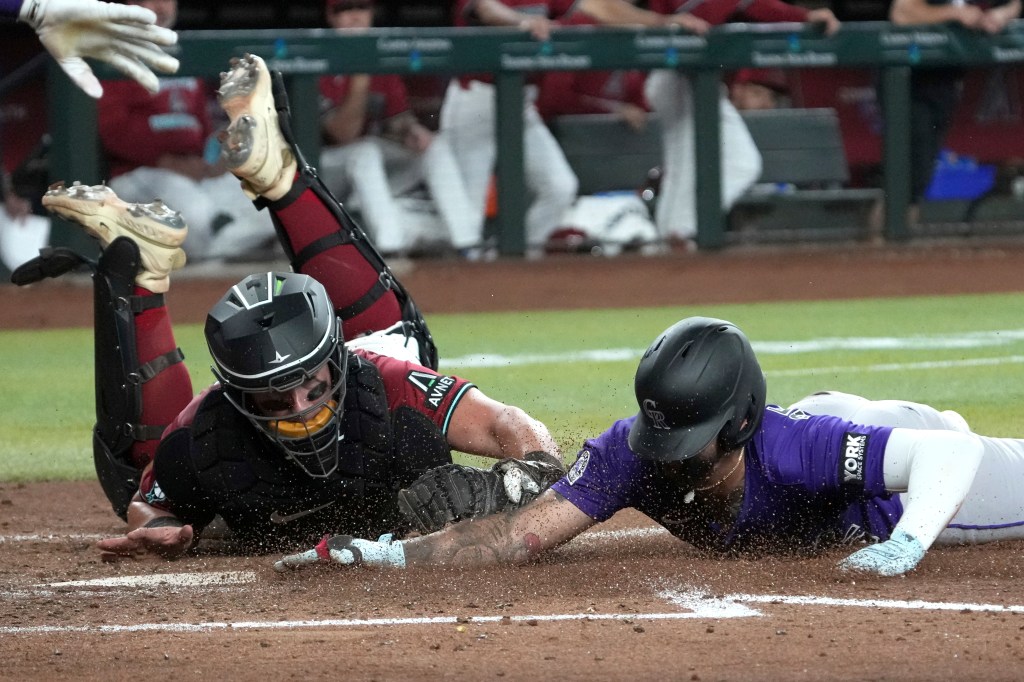 Diamondbacks rake woeful Rockies for 13 runs with two outs