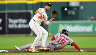 Boston Red Sox's Roman Anthony (19) steals second base as Houston Astros shortstop Jeremy Peña reaches for the throw during the first inning of a baseball game Tuesday, Aug. 12, 2025, in Houston. (AP Photo/David J. Phillip)