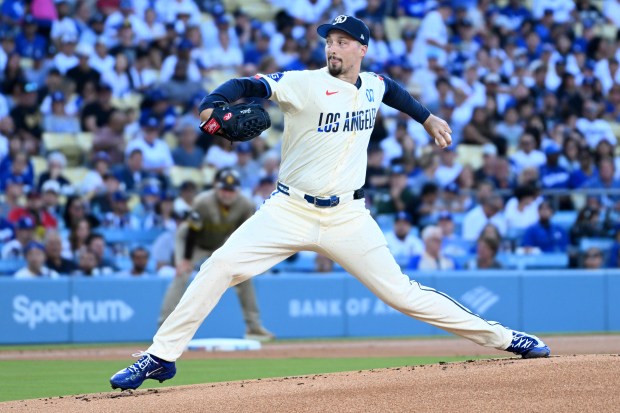 Dodgers starting pitcher Blake Snell throws to the plate during...