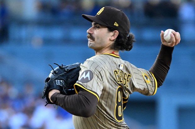 San Diego Padres starting pitcher Dylan Cease throws to the...
