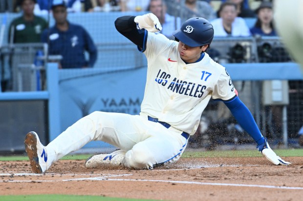 Dodgers star Shohei Ohtani scores against the San Diego Padres...