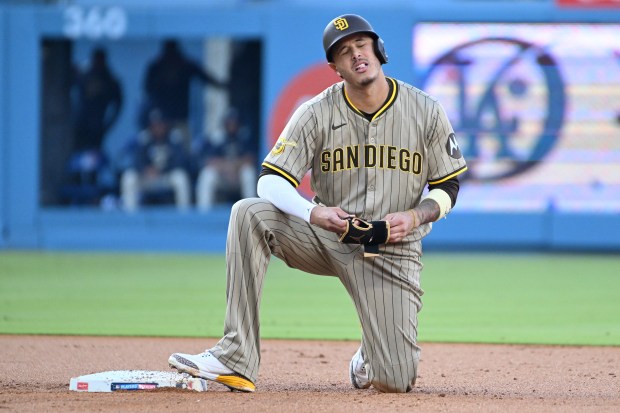 San Diego Padres star Manny Machado reacts after being tagged...