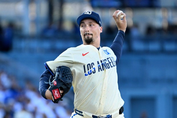 Dodgers starting pitcher Blake Snell throws to the plate during...