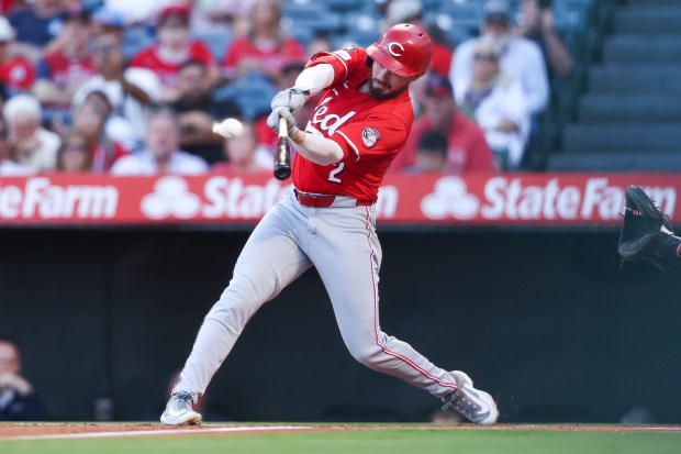 Cincinnati Reds designated hitter Gavin Lux hits a home run...